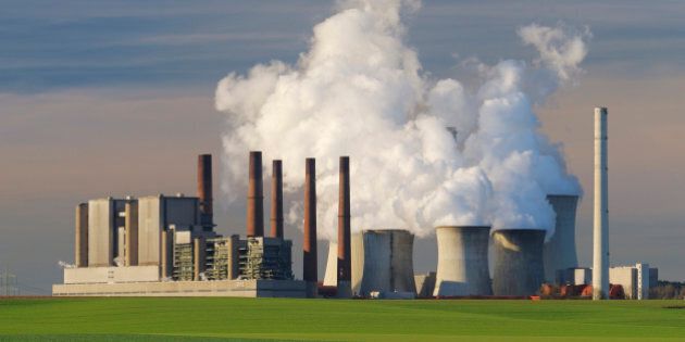 Coal fired power station Neurath emitting steam and smoke from cooling tower and smokestack. Emissions by coal fired power stations are regarded as one of the main reasons for global warming. Niederaussem, North Rhine-Westphalia, Germany, Europe.