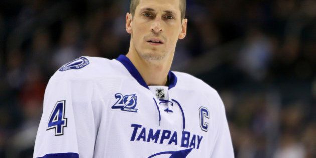 WINNIPEG, CANADA - APRIL 16: Vincent Lecavalier #4 of the Tampa Bay Lightning looks on during the pre-game warm up prior to NHL action against the Winnipeg Jets at the MTS Centre on April 16, 2013 in Winnipeg, Manitoba, Canada. (Photo by Travis Golby/NHLI via Getty Images)