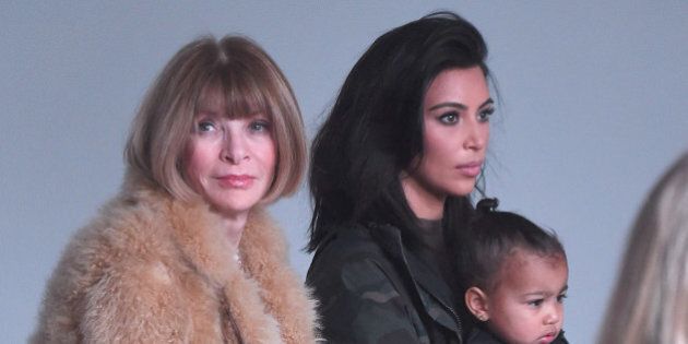 NEW YORK, NY - FEBRUARY 12: (L-R) Anna Wintour, Kim Kardashian and North West attend the adidas show during Mercedes-Benz Fashion Week Fall 2015 at Skylight Clarkson SQ. on February 12, 2015 in New York City. (Photo by Gary Gershoff/WireImage)