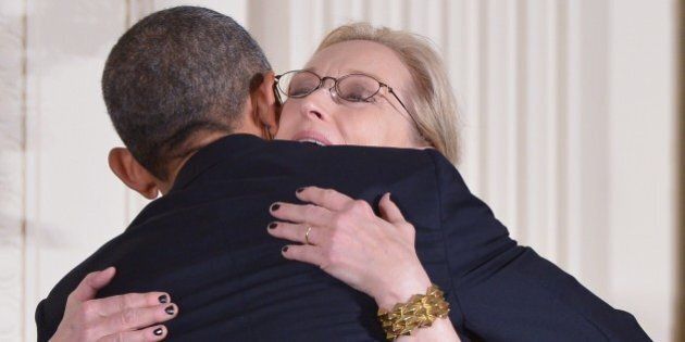US President Barack Obama hugs actress Meryl Streep at the end of the Medal of Freedom ceremony in the East Room of the White House on November 24, 2014 in Washington, DC. The Medal of Freedom is the country highest civilian honor. AFP PHOTO/Mandel NGAN (Photo credit should read MANDEL NGAN/AFP/Getty Images)