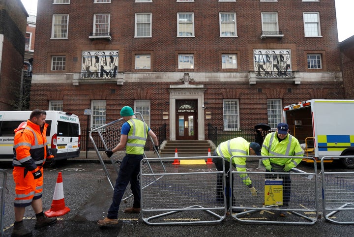 Workers build a media pen opposite the entrance to the Lindo Wing of St Mary's hosital where Britain's Catherine, The Duchess of Cambridge, is due to give birth to her third child, in London, April 9, 2018. REUTERS/Peter Nicholls - RC1C3F716100