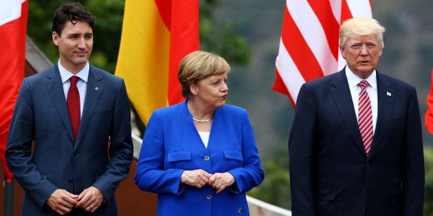 Le premier ministre canadien Justin Trudeau, la chancelière allemande Angela Merkel et le président américain Donald Trump lors du G7 de 2017 en Italie.