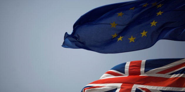 The Union Jack (bottom) and the European Union flag are seen flying, at the border of Gibraltar with Spain, in the British overseas territory of Gibraltar, historically claimed by Spain, June 27, 2016, after Britain voted to leave the European Union in the EU Brexit referendum. REUTERS/Jon Nazca