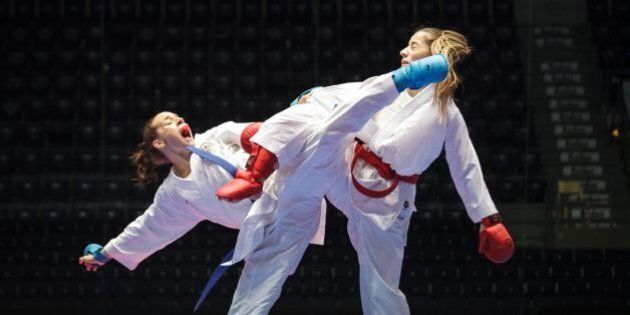 Serap Ozcelik of Turkey, right, and Austria's Bettina Plank in action during the women's Kumite -50 kg competition, at the Karate European Championship, Saturday May 3, 2014 in Tampere, Finland. Ozcelik won the gold medal. (AP Photo/TT News Agency, Aleksi Tuomola) FINLAND OUT
