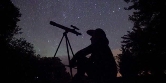 A stargazer waits for the Perseid meteor shower to begin near Bobcaygeon, Ontario, August 12, 2015. Picture taken August 12, 2015. REUTERS/Fred Thornhill