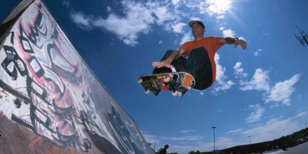 Skateboarding using ramp at skate park