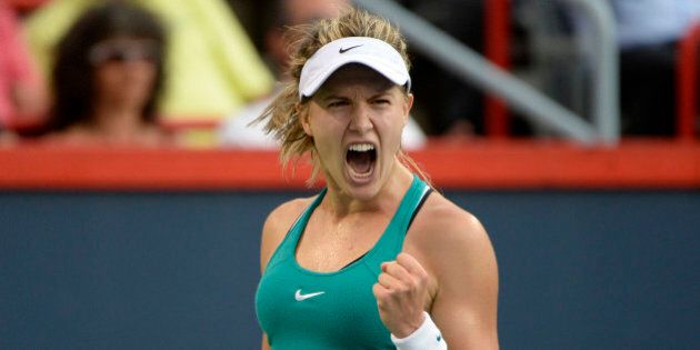 Jul 27, 2016; Montreal, Quebec, Canada; Eugenie Bouchard of Canada reacts after making a point against Domimika Cibulkova of Slovakia (not pictured) on day three of the Rogers Cup tennis tournament at Uniprix Stadium. Mandatory Credit: Eric Bolte-USA TODAY Sports