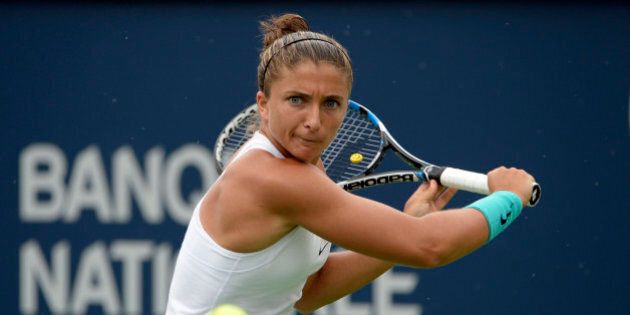Jul 26, 2016; Montreal, Quebec, Canada; Sara Errani of Italy hits a backhand against Aleksandra Wozniak of Canada (not pictured) on day two of the Rogers Cup tennis tournament at Uniprix Stadium. Mandatory Credit: Eric Bolte-USA TODAY Sports