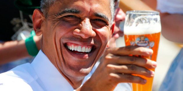 U.S. President Barack Obama toasts with beer as he visits Kruen, southern Germany, June 7, 2015. Leaders from the Group of Seven (G7) industrial nations meet on Sunday in the Bavarian Alps for a summit overshadowed by Greece's debt crisis and ongoing violence in Ukraine. REUTERS/Hannibal Hanschke TPX IMAGES OF THE DAY