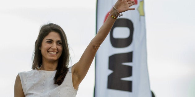 Virginia Raggi, the Five Star Movement's candidate for mayor of Rome, gestures during a campaign rally in Ostia, near Rome, Italy, on Friday, June 17, 2016. After topping the first round of local elections, Raggi could become Rome first-female mayor in a run-off on Sunday. Photographer: Alessia Pierdomenico/Bloomberg via Getty Images