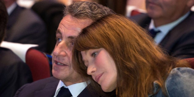 Former French President and candidate for the right-wing Les Republicains (LR) party primaries ahead of the 2017 presidential election Nicolas Sarkozy and his wife Carla Bruni attend a meeting in Toulon, southeastern France, on October 21, 2016. / AFP / BERTRAND LANGLOIS (Photo credit should read BERTRAND LANGLOIS/AFP/Getty Images)