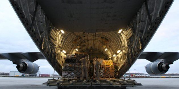 Canadian forces load a CC-17 Globemaster CFB Trenton, Ont., on Sunday Apr. 26, 2015. Canada is dispatching advance elements of its highly specialized disaster assistance response team to earthquake-ravaged Nepal. THE CANADIAN PRSS/Lars Hagberg