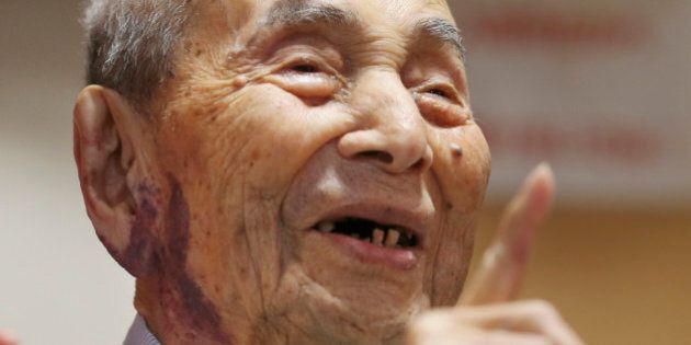 Yasutaro Koide, the 112-year-old living in the central Japanese city of Nagoya, smiles upon being formally recognized as the world's oldest man by the Guinness World Records at a nursing home in Nagoya Friday, Aug. 21, 2015. Koide was born on March 13, 1903 and worked as a tailor when he was younger. He became the worlds oldest man with the death of Sakari Momoi of Tokyo in July at age 112. (AP Photo/Koji Sasahara)