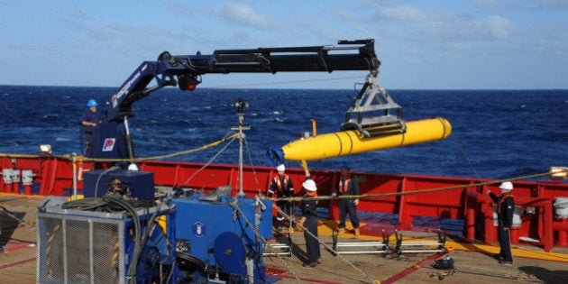 AT SEA - APRIL 1: In this handout image provided by the U.S. Navy, The Bluefin 21, Artemis autonomous underwater vehicle (AUV) is hoisted back on board the Australian Defence Vessel Ocean Shield after successful buoyancy testing April 1, 2014 in the Indian Ocean. Joint Task Force 658 is currently supporting Operation Southern Indian Ocean, searching for the missing Malaysia Airlines flight MH370. The airliner disappeared on March 8 with 239 passengers and crew on board and is suspected to have crashed into the southern Indian Ocean. (Photo by Mass Communication Specialist 1st Class Peter D. Blair/U.S. Navy via Getty Images)