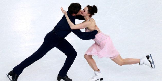 SOCHI, RUSSIA - FEBRUARY 17: Tessa Virtue and Scott Moir of Canada compete in the Figure Skating Ice Dance Free Dance on Day 10 of the Sochi 2014 Winter Olympics at Iceberg Skating Palace on February 17, 2014 in Sochi, . (Photo by Clive Mason/Getty Images)