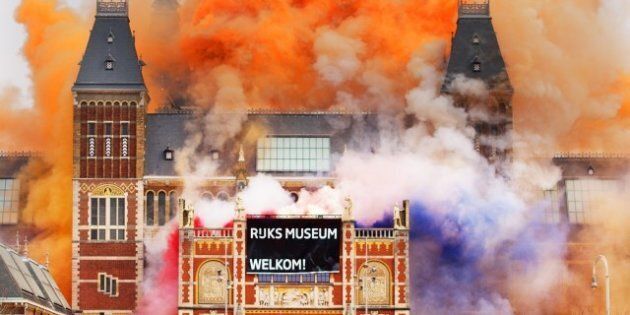 A marching band plays as fireworks are ignited at the Rijksmuseum in Amsterdam during the official re-opening of the Rijksmuseum in Amsterdam on April 13, 2013. The museum opens its doors to the public after a vast 10-year renovation aimed at breathing new life into its unparallelled collection of Golden Age masterpieces. AFP PHOTO / ANP / ROBIN UTRECHT --NETHERLANDS OUT-- (Photo credit should read ROBIN UTRECHT/AFP/Getty Images)