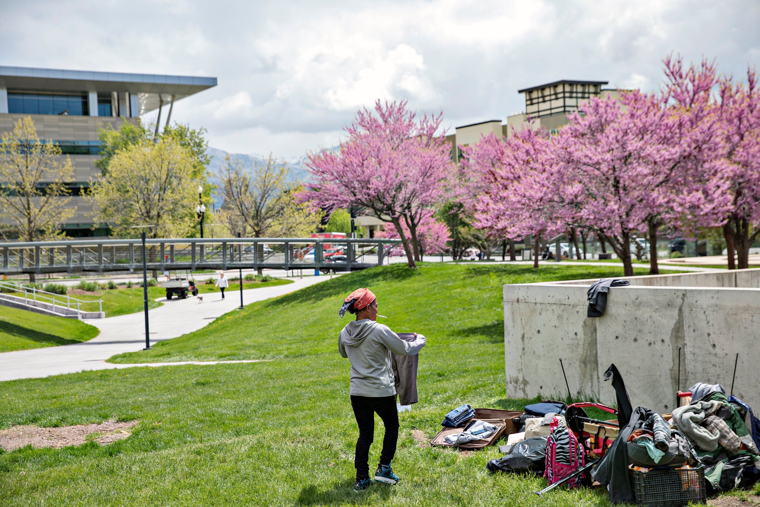 Dorriane Olson, 47, organizes her belongings in the courtyard at Library Square on May 1, 2019, in downtown Salt Lake City. O