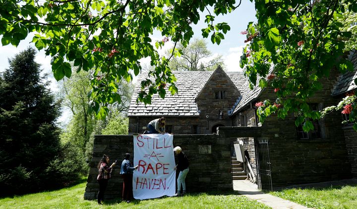 Swarthmore College students hang a banner near the Phi Psi fraternity house during a sit-in at the suburban Philadephia campus on April 29 after documents surfaced with derogatory comments about women and the LGBTQ community and jokes about sexual assault.
