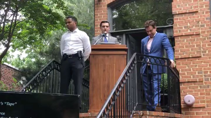 A screengrab from a Facebook livestream shows Jacob Wohl flanked by a security guard and conspiracy theorist Jack Burkman, right, at his press conference on Wednesday.