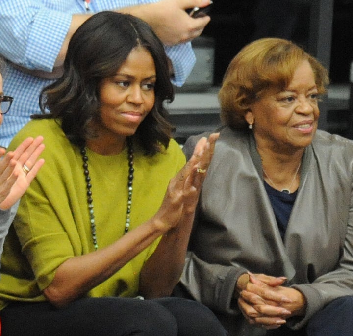 Michelle Obama watching a basketball game with her mother Marian Robinson in 2014.