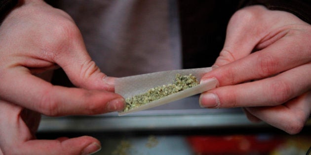 Brian Lawson rolls his marijuana cigarette at the BC Marijuana Party Headquarters in Vancouver, British Columbia, Tuesday, Feb. 23, 2010. Vancouver is in the marijuana-friendly corner of Canada, and it's hard to miss. Hastings Street alone has several stores that sell marijuana seeds, and the BC Marijuana Party Headquarters is a veritable weed smoker's den. (AP Photo/Jae C. Hong)