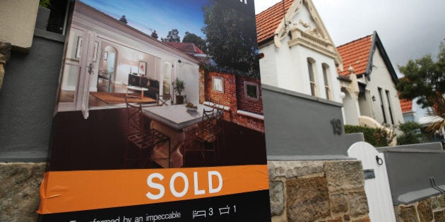 A 'Sold' sign is displayed outside a house in the suburb of Bellevue Hill in Sydney, Australia, on Thursday, June 18, 2015. Surging home prices in cities including Sydney are unlikely to be affected by the banking regulator's efforts to curb mortgage lending to investors, according to National Australia Bank Ltd. Photographer: Brendon Thorne/Bloomberg via Getty Images