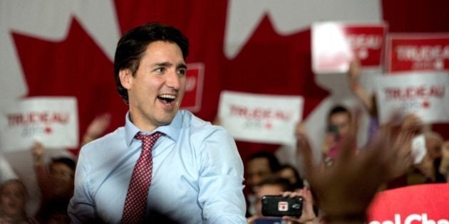 Canadian Liberal Party leader Justin Trudeau arrives at a victory rally in Ottawa on October 20, 2015. Canada is 'back' on the world stage, newly-elected prime minister Justin Trudeau said Tuesday after a landslide victory that ended nearly a decade of conservative rule. 'I want to say to this country's friends all around the world, many of you have worried that Canada has lost its compassionate and constructive voice in the world over the past 10 years,' Trudeau told a rally. 'On behalf of 35 million Canadians, we're back' AFP PHOTO/NICHOLAS KAMM (Photo credit should read NICHOLAS KAMM/AFP/Getty Images)