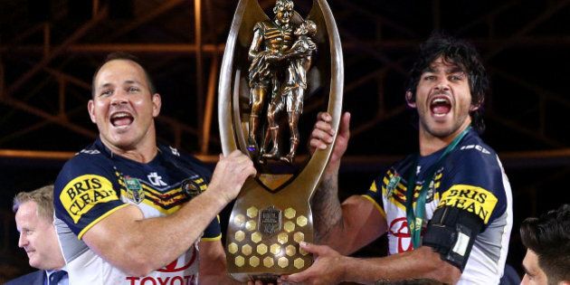 SYDNEY, AUSTRALIA - OCTOBER 04: Matthew Scott of the Cowboys and Johnathan Thurston of the Cowboys hold aloft the premiership trophy after winning the 2015 NRL Grand Final match between the Brisbane Broncos and the North Queensland Cowboys at ANZ Stadium on October 4, 2015 in Sydney, Australia. (Photo by Cameron Spencer/Getty Images)