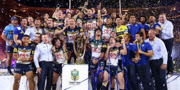 SYDNEY, AUSTRALIA - OCTOBER 04: The Cowboys celebrate on the podium with the premiership trophy after winning the 2015 NRL Grand Final match between the Brisbane Broncos and the North Queensland Cowboys at ANZ Stadium on October 4, 2015 in Sydney, Australia. (Photo by Cameron Spencer/Getty Images)