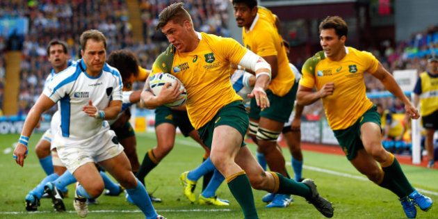 BIRMINGHAM, ENGLAND - SEPTEMBER 27: Sean McMahon of Australia runs in to score his side's first try during the 2015 Rugby World Cup Pool A match between Australia and Uruguay at Villa Park on September 27, 2015 in Birmingham, United Kingdom. (Photo by Dan Mullan/Getty Images)