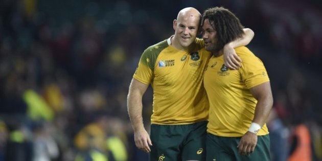 Australia's hooker Stephen Moore (L) celebrates with Australia's hooker Tatafu Polota-Nau (R) after winning a Pool A match of the 2015 Rugby World Cup between Wales and Australia at Twickenham Stadium, southwest London, on October 10, 2015.AFP PHOTO / MARTIN BUREAURESTRICTED TO EDITORIAL USE, NO USE IN LIVE MATCH TRACKING SERVICES, TO BE USED AS NON-SEQUENTIAL STILLS (Photo credit should read MARTIN BUREAU/AFP/Getty Images)