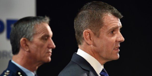 New South Wales state Premier Mike Baird (R) and police commissioner Andrew Scipione (L) speak to the media in Sydney on October 3, 2015, the day after an attack in Sydney in which a 15-year-old gunman shot dead a civilian police employee. Australian Prime Minister Malcolm Turnbull said on October 3 that the attack in Sydney appeared to have been an act of terrorism. AFP PHOTO/William WEST (Photo credit should read WILLIAM WEST/AFP/Getty Images)