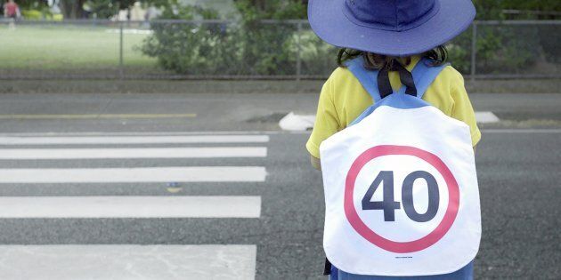 Students at Junction Park State School were handed 40km speed sign backpacks as school holidays ends.