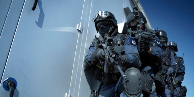 Officers of the police elite unit SWAT 'Special Weapons and Tactics' during a hostage rescue operation.