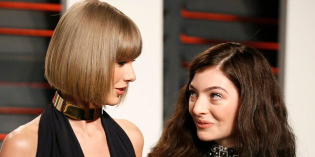Taylor Swift towers over Lorde at the Vanity Fair Oscar Party in Beverly Hills, California, February 2016.