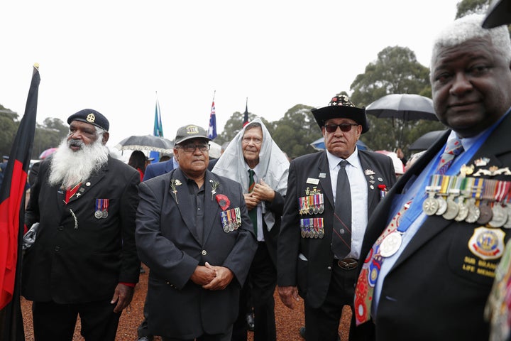 Ex-serviceman from the NSW Aboriginal and Torres Strait Islander Association get ready to march down Anzac Parade.