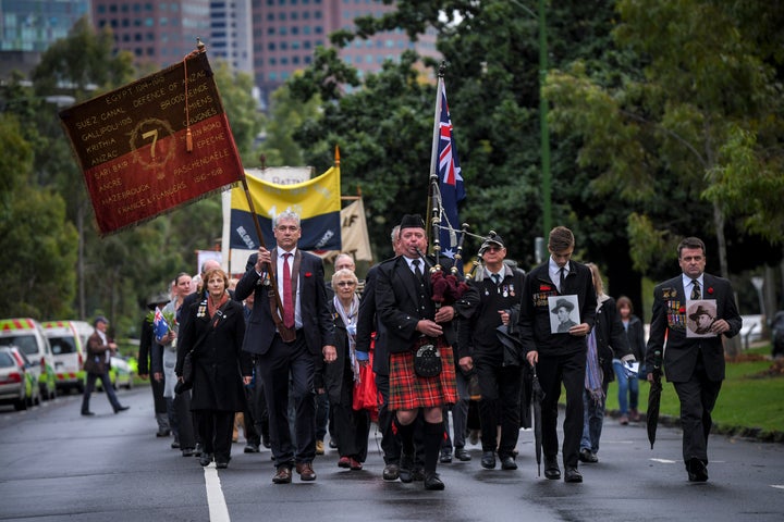 Representatives of WWI battalion associations march near the Shrine of Remembrance on the ANZAC day.