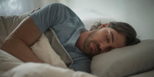 USA, New Jersey, Man sleeping in bed