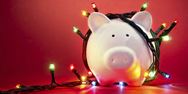 Piggy bank wrapped in Christmas string lights