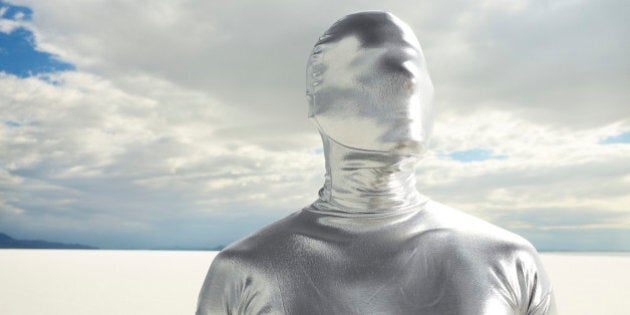 Man in Silver Suit on Salt Flats.