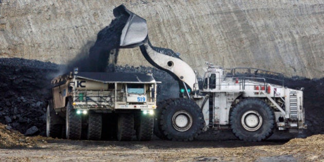 FILE - In this March 28, 2007 file photo, lignite coal is mined at the Freedom Mine in Beulah, N.D. Sixteen years after North Dakota agreed to finance research aimed at revitalizing growth in the state's lignite industry, only one project has been built while other proposals that promised jobs and increased state tax revenue resulted in little more than multimillion-dollar studies that failed to find a clean and cost-effective use for the plentiful but low-grade coal. (AP Photo/James MacPherson, File)