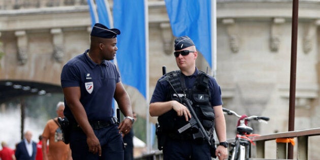 Policemen patrol during the opening day of the Paris Plages beach festival along the banks of River Seine in Paris, France, six days after a truck driver killed 84 people when he mowed through a crowd on the French Riviera, July 20, 2016. REUTERS/Charles Platiau