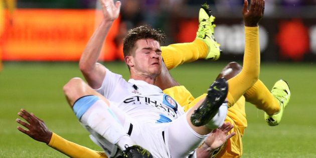 PERTH, AUSTRALIA - OCTOBER 21: Guyon Fernandez of the Glory brings down Connor Chapman of Melbourne during the FFA Cup Semi Final match between Perth Glory and Melbourne City FC at nib Stadium on October 21, 2015 in Perth, Australia. (Photo by Paul Kane/Getty Images)