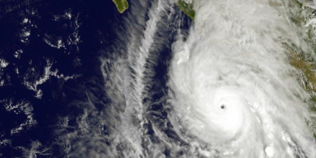This satellite image taken at 1:45 p.m. EDT on Friday, Oct. 23, 2015, and released by NASA, shows the eastern quadrant and pinhole eye of Hurricane Patricia moving towards southwestern Mexico. The Category 5 storm is strongest ever in the Western Hemisphere, according to forecasters. (NOAA GOES Project/NASA via AP)