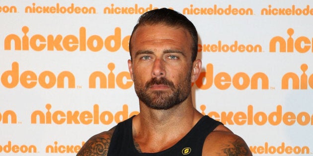 SYDNEY, AUSTRALIA - SEPTEMBER 27: 'Commando' Steve Willis poses on the media wall ahead of the Nickelodeon Slimefest 2013 matinee show at Sydney Olympic Park Sports Centre on September 27, 2013 in Sydney, Australia. (Photo by Lisa Maree Williams/Getty Images for Nickelodeon Australia)