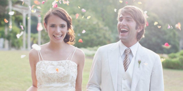 Bride and groom holding hands