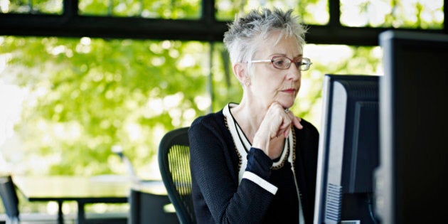 Businesswoman working on computer in office