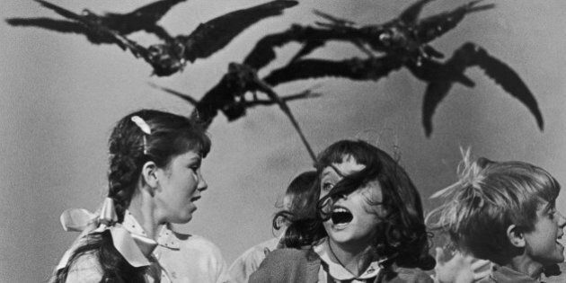 A group of schoolchildren flail about in terror at the avian attack in a publicity still for 'The Birds', directed by Alfred Hitchcock for Universal, 1963. (Photo by Archive Photos/Getty Images)