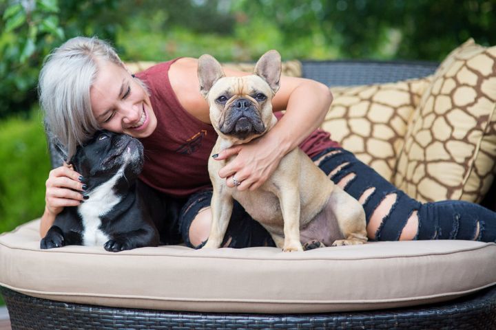 Caroline at home with her French bulldogs, Diesel and Brie. Who knew French bulldogs were so cute?