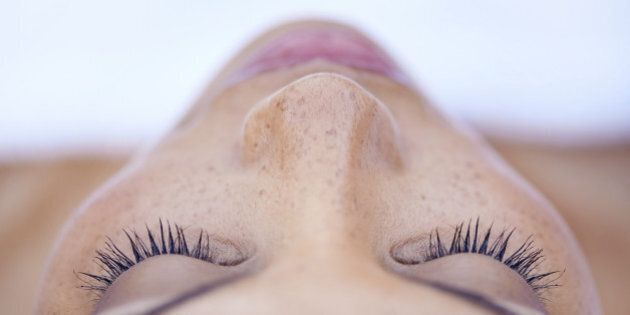 Cropped shot of an attractive young woman lying on her back